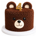 A custom Teddy Bear Cake featuring textured chocolate frosting shaped like fur, with cute fondant eyes, nose, ears, and a gold number 4 topper, perfect for a child's birthday.