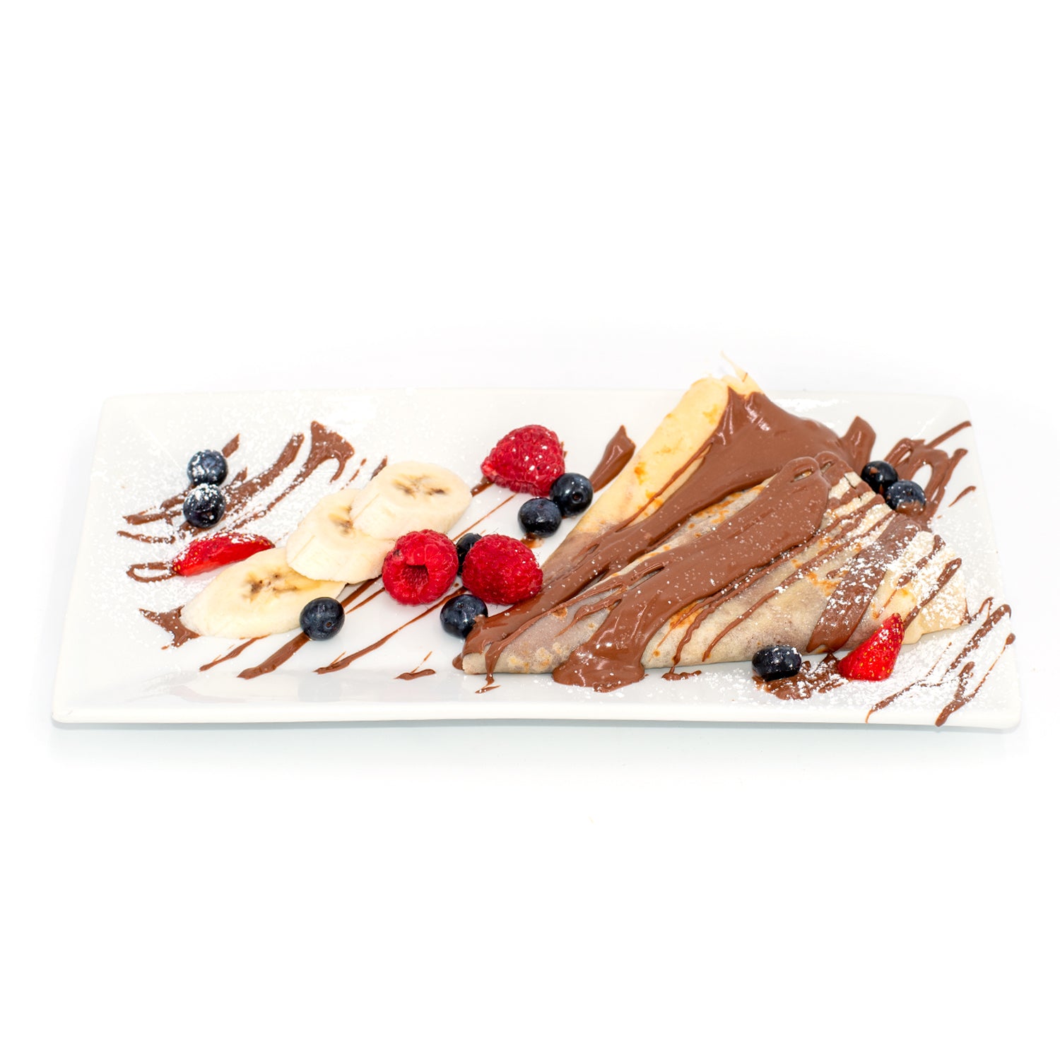 Crepes with chocolate hazelnut spread, sliced banana, raspberries, blueberries and powdered sugar on a white plate