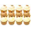 Assorted gourmet cupcakes with swirl frosting and decorative toppings, arranged in rows
