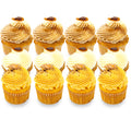 Assorted gourmet cupcakes with swirled frosting and festive toppings arranged in rows.