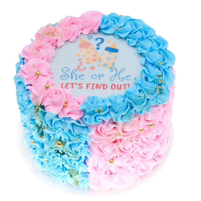 She Or He Cake decorated with pink and blue frosting swirls and gold accents, featuring a gender reveal design with baby bottles and question marks.