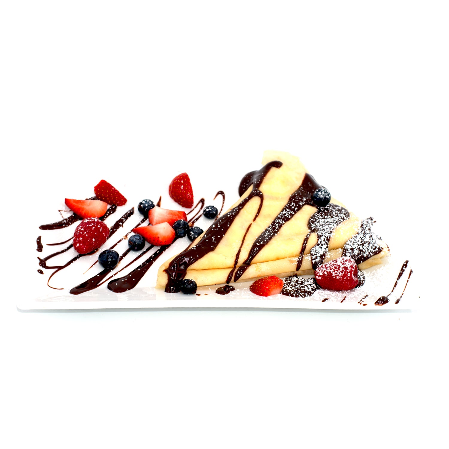 Crepes with chocolate sauce, strawberries, blueberries, and powdered sugar on a white plate