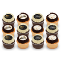 Assorted gourmet birthday cupcakes with chocolate and vanilla frosting, festive edible toppers